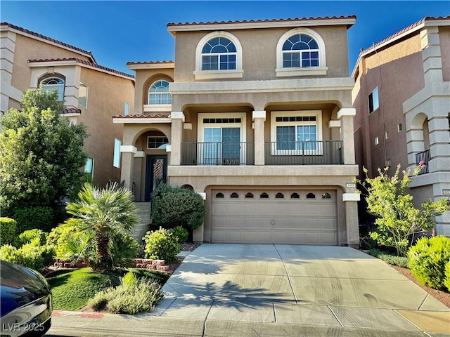 mediterranean / spanish house featuring a garage