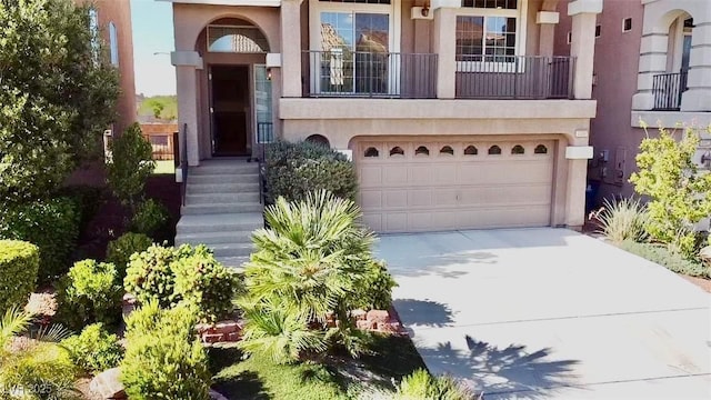 property entrance featuring a garage and a balcony