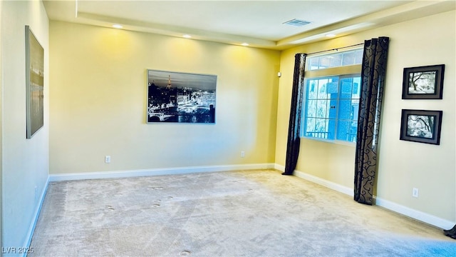 unfurnished room featuring light colored carpet