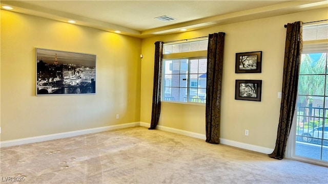 empty room featuring light carpet