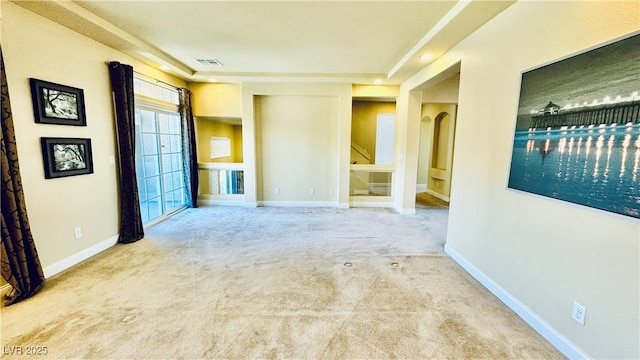 empty room with light colored carpet