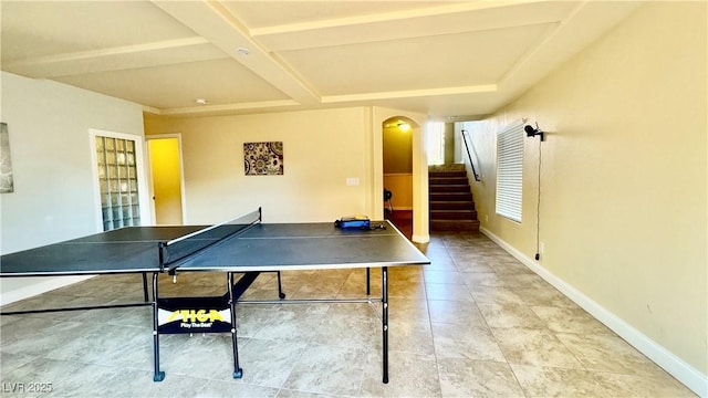 recreation room featuring tile patterned floors, coffered ceiling, and beam ceiling