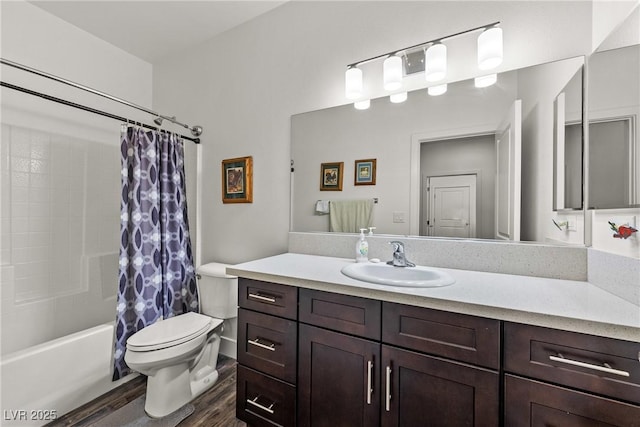 full bathroom with vanity, hardwood / wood-style flooring, shower / bath combination with curtain, and toilet