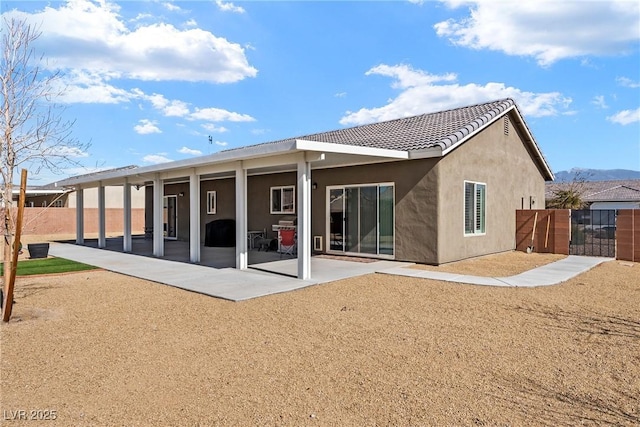 rear view of house with a patio