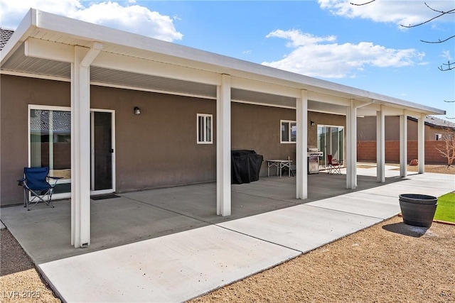 back of house with a patio