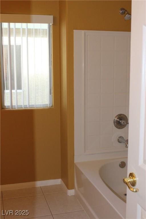 bathroom featuring  shower combination, tile patterned flooring, and a wealth of natural light