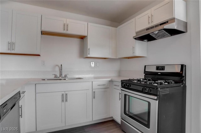 kitchen featuring white cabinetry, appliances with stainless steel finishes, dark hardwood / wood-style floors, and sink