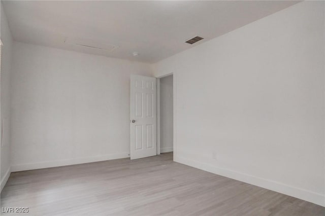 unfurnished room featuring light hardwood / wood-style flooring