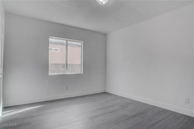 empty room featuring wood-type flooring