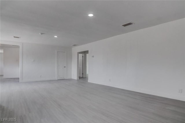 unfurnished room featuring light hardwood / wood-style flooring