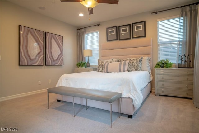 bedroom featuring ceiling fan and light colored carpet