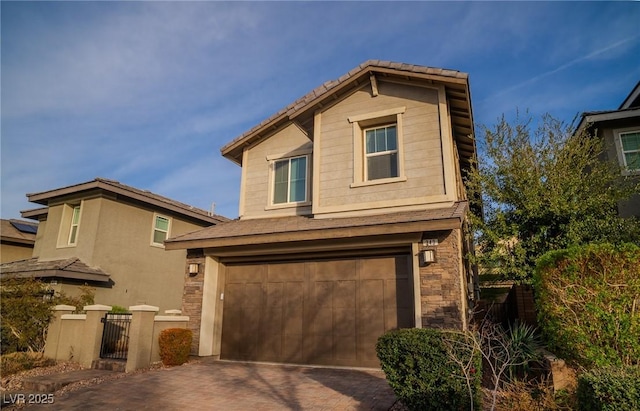 front of property with a garage