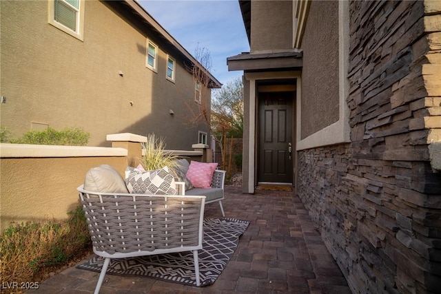 property entrance with a patio