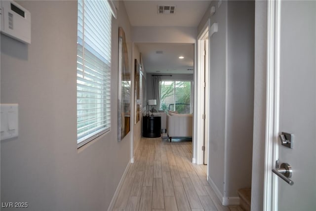 hallway with light wood-type flooring