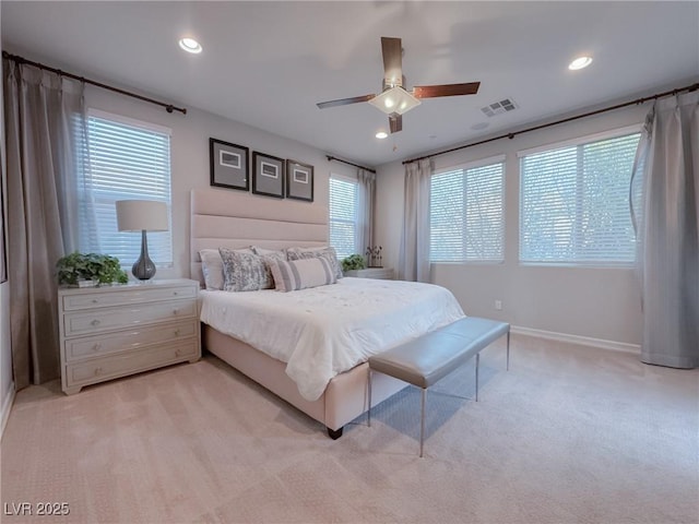 bedroom with ceiling fan and light carpet