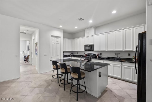 723 Orange Plume Walk Unit 0, Henderson, NV 89011 - kitchen featuring black appliances, recessed lighting, white cabinetry, and visible vents