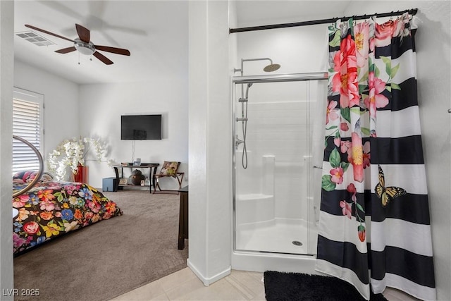 bathroom with ceiling fan and walk in shower