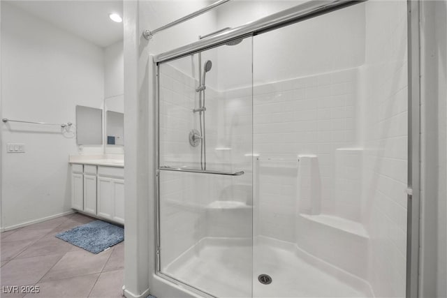 723 Orange Plume Walk Unit 0, Henderson, NV 89011 - bathroom featuring vanity, baseboards, a stall shower, and tile patterned floors