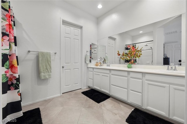 723 Orange Plume Walk Unit 0, Henderson, NV 89011 - full bathroom featuring a sink, walk in shower, double vanity, and visible vents