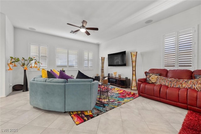 living room featuring ceiling fan and light tile patterned flooring