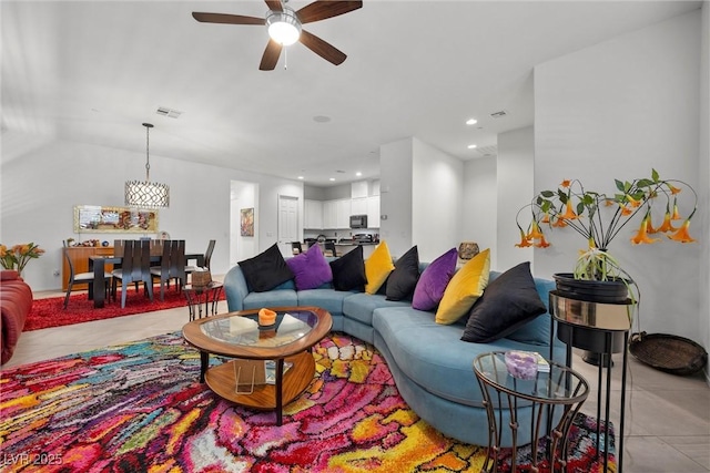 living room with light tile patterned floors and ceiling fan