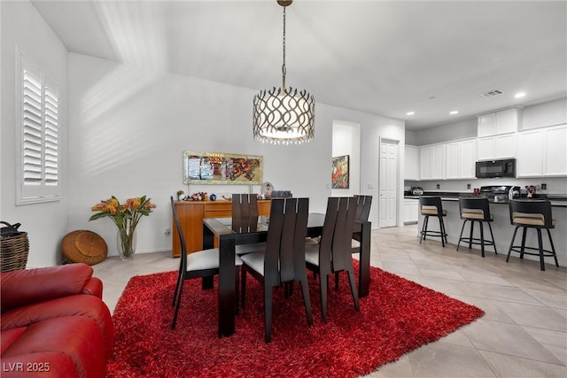 dining area with light tile patterned flooring