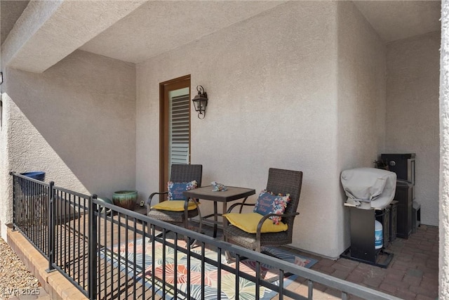 view of patio with a balcony