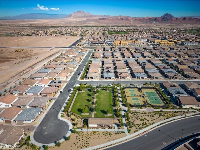 birds eye view of property featuring a mountain view