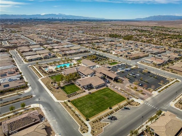 birds eye view of property with a mountain view