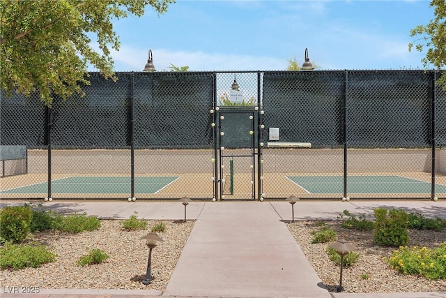 723 Orange Plume Walk Unit 0, Henderson, NV 89011 - view of tennis court with fence and a gate