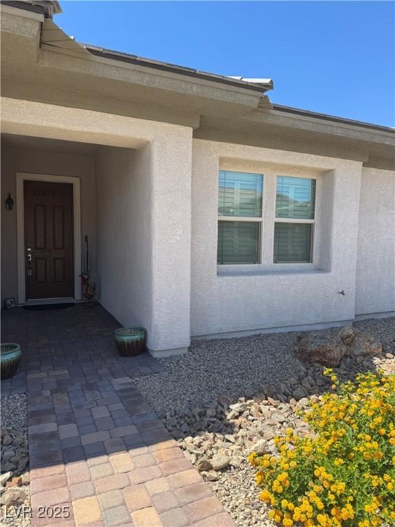 723 Orange Plume Walk Unit 0, Henderson, NV 89011 - doorway to property with stucco siding