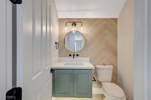 bathroom featuring vanity and toilet