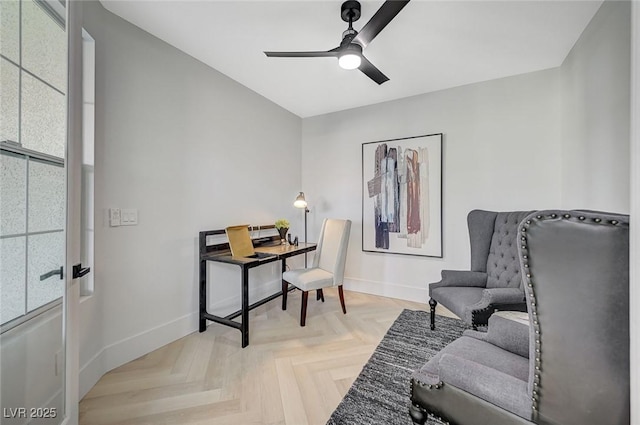 office space with light parquet flooring and ceiling fan