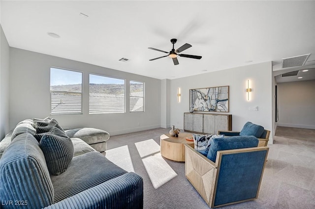 living room featuring light colored carpet and ceiling fan