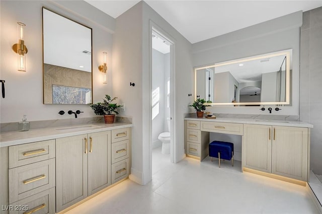 bathroom with vanity and toilet