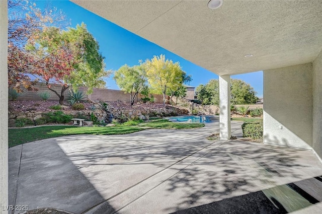 view of patio / terrace featuring a fenced in pool