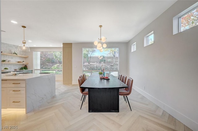 dining space featuring light parquet flooring