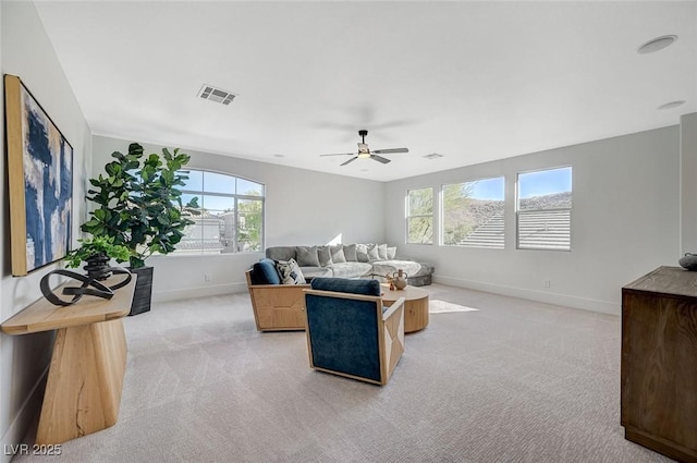 living room featuring light carpet and ceiling fan