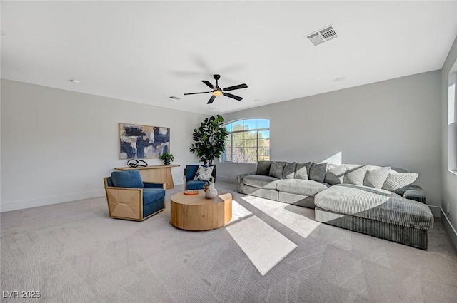 living room featuring light carpet and ceiling fan