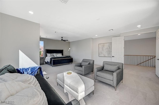 carpeted living room with ceiling fan