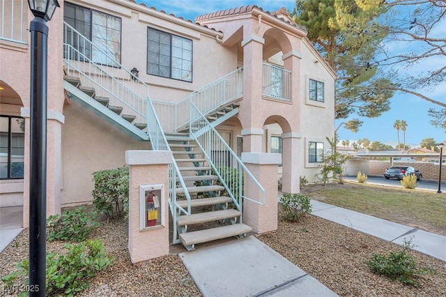 4861 S Torrey Pines Dr Unit 201, Las Vegas, NV 89103 - view of front of property featuring stairway and stucco siding
