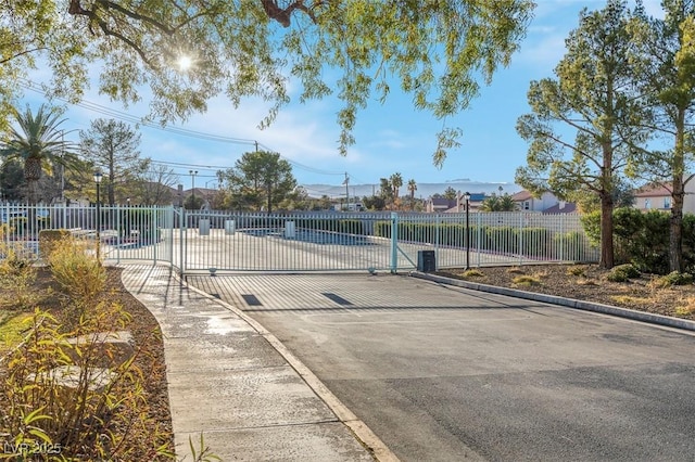 4861 S Torrey Pines Dr Unit 201, Las Vegas, NV 89103 - view of tennis court with fence and a gate