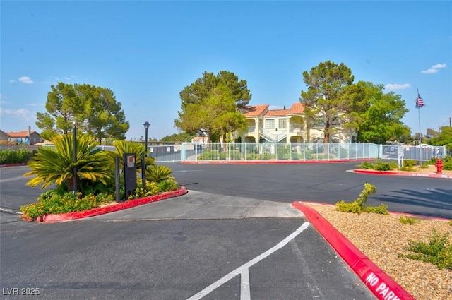 4861 S Torrey Pines Dr Unit 201, Las Vegas, NV 89103 - view of asphalt road featuring curbs and street lighting