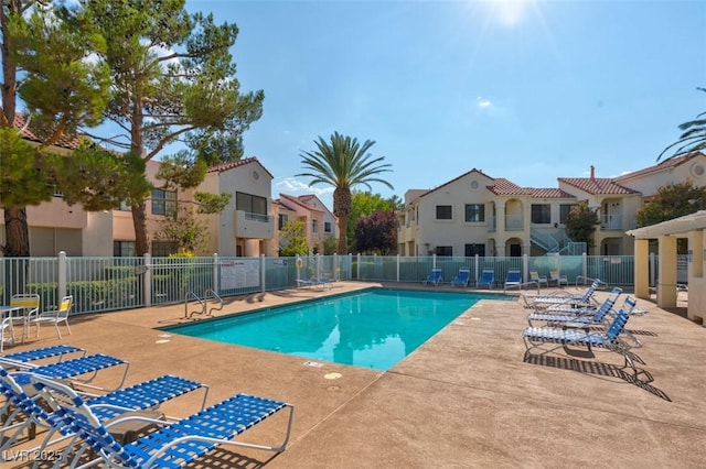4861 S Torrey Pines Dr Unit 201, Las Vegas, NV 89103 - community pool with fence, a patio, and a residential view