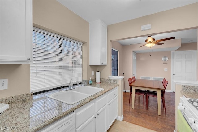 4861 S Torrey Pines Dr Unit 201, Las Vegas, NV 89103 - kitchen featuring a sink, white cabinetry, and ceiling fan