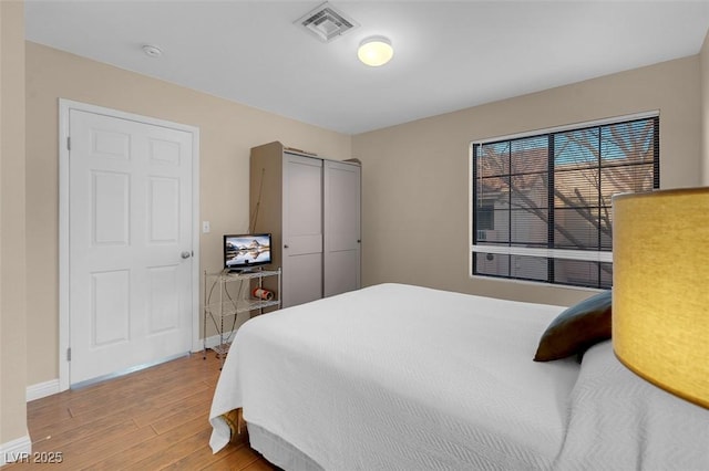 4861 S Torrey Pines Dr Unit 201, Las Vegas, NV 89103 - bedroom featuring light wood-type flooring, baseboards, and a closet