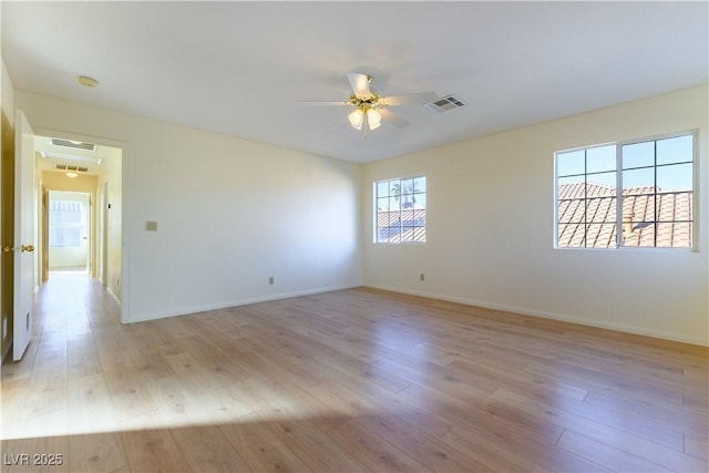 unfurnished room featuring ceiling fan and light hardwood / wood-style flooring