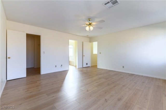 spare room featuring light hardwood / wood-style flooring and ceiling fan