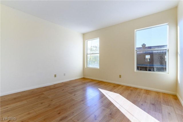 unfurnished room featuring light wood-type flooring