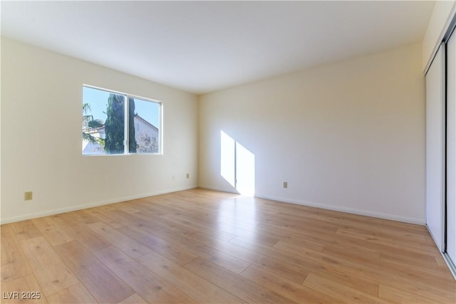 spare room with light wood-type flooring